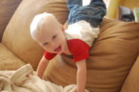 dsc_2093.jpg The climber can go over the couch now.  Only Devin would pose mid-tumble for the camera.