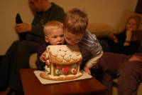 dsc_4192.jpg Every year Eamon gets a gingerbread house that he licks for the next week.  This year, Devin joined in.