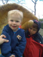 img_0152.jpg With a new friend at Dinosaur Playground